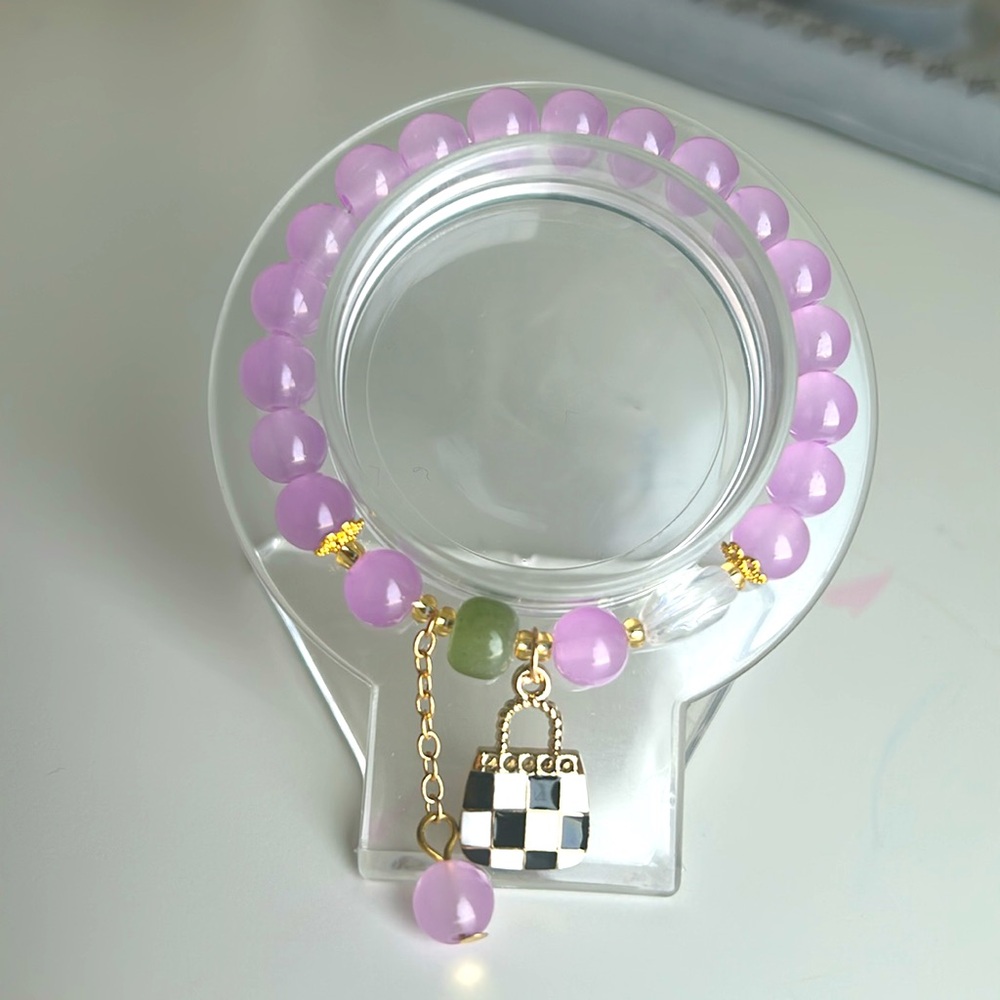 Purple glass bead with purse charm, charm bracelet